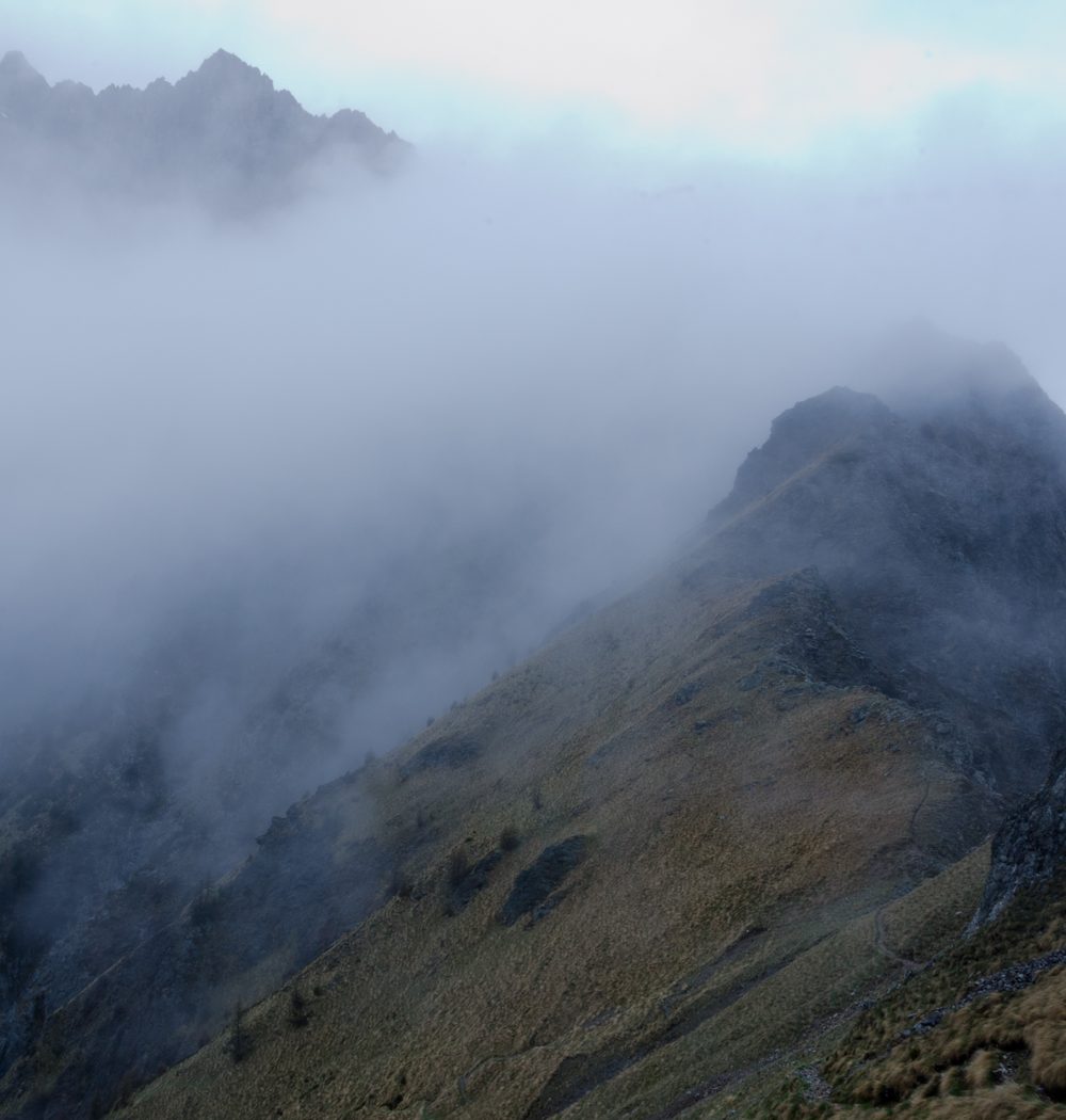 Mountain ridge wrapped in fog