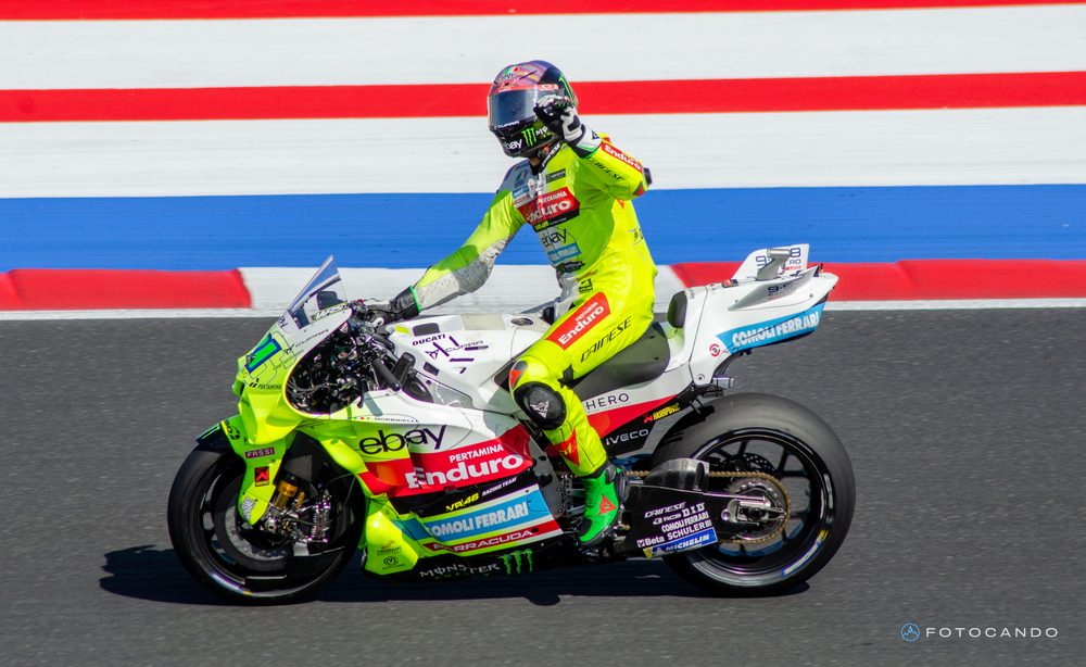 MotoGP, rider in fluorescent yellow leathers in front of the kerbs, Misano 2025