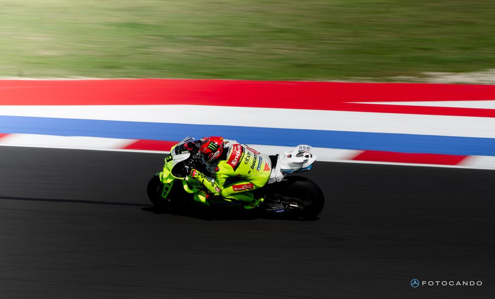 MotoGP, rider leaning over on the coloured kerbs, Misano 2025